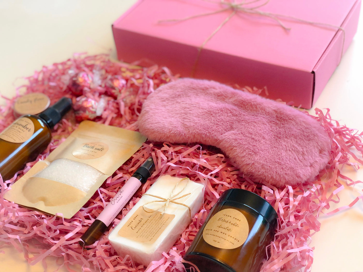 Gift boxes with candles, soap, perfume, eye mask and moisturiser